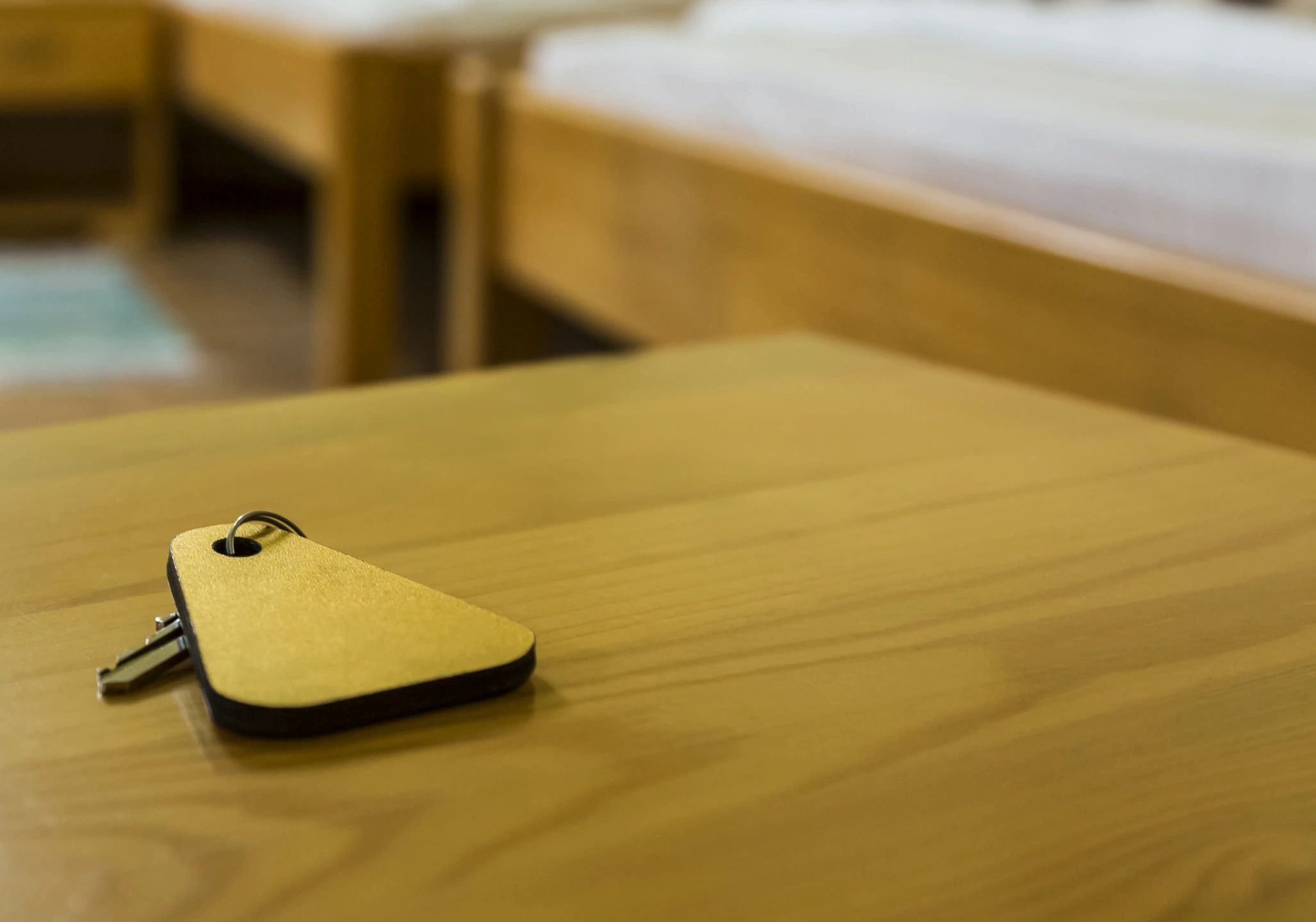 Gold key on wooden table